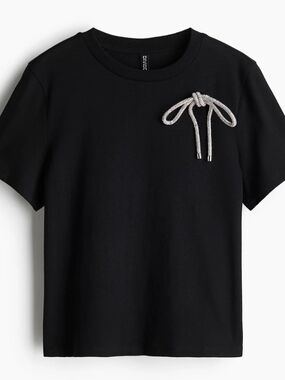 Divided Black T‑Shirt with Rhinestone Bow Accent